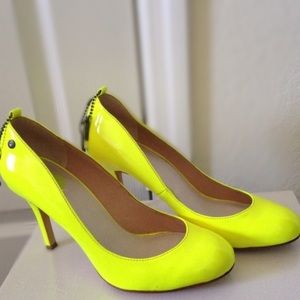 Bright neon yellow heels by Diesel. Adds a pop of color to any outfit!